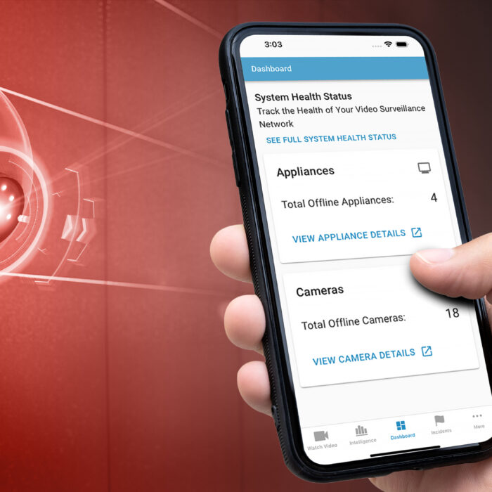 Mobile phone showing the System Health data, positioned next to a security camera.