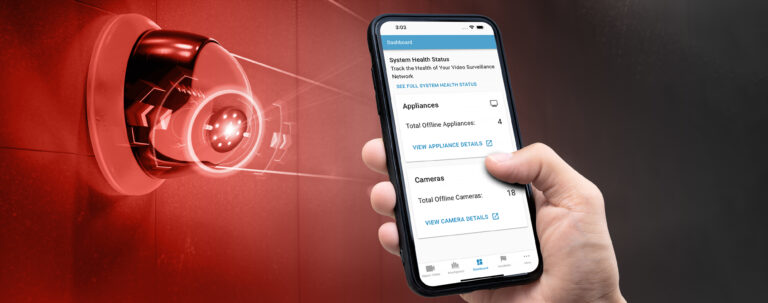 Mobile phone showing the System Health data, positioned next to a security camera.