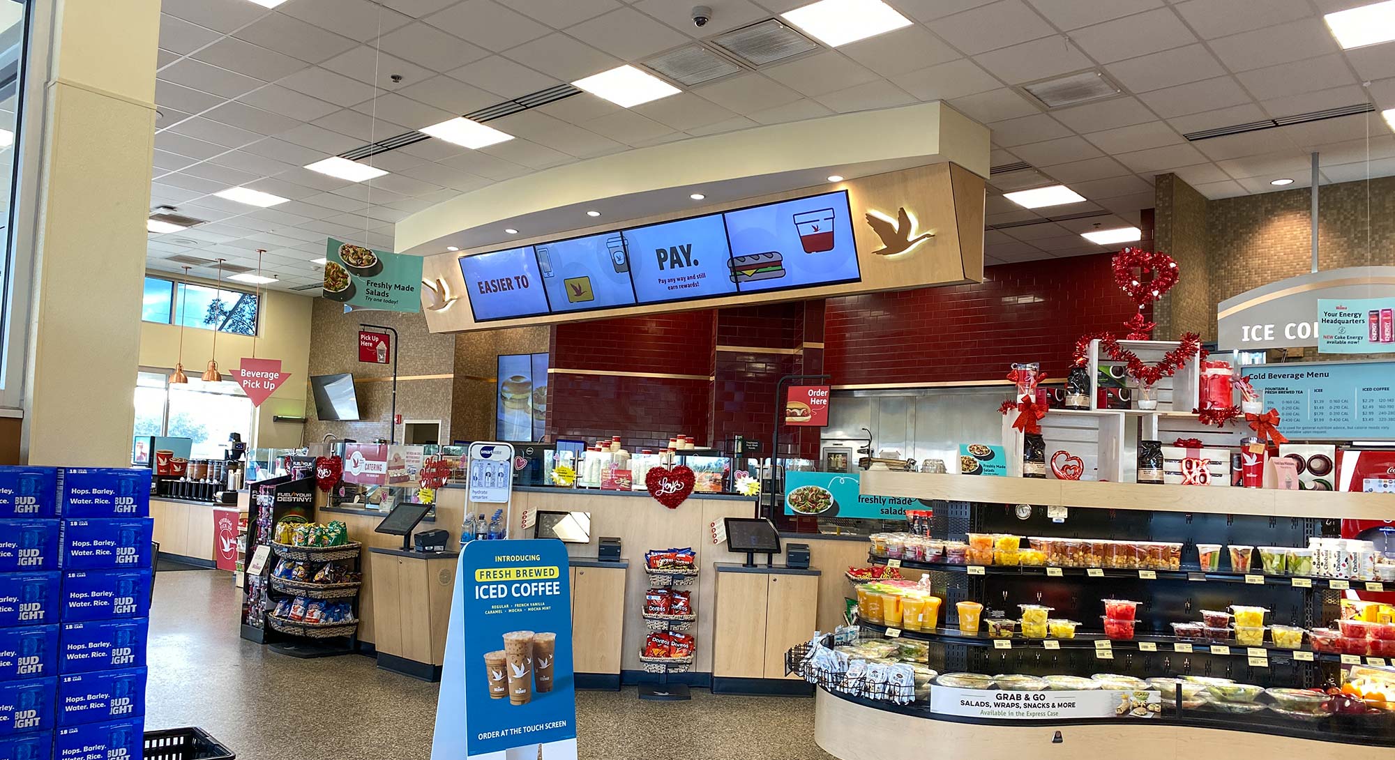 Convenience store with cloud-based video surveillance cameras on ceiling.
