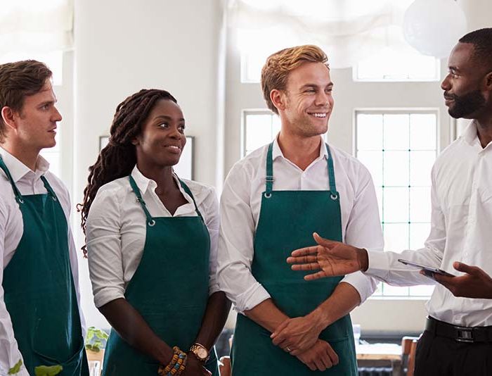 Managing a restaurant in form of a team meeting.