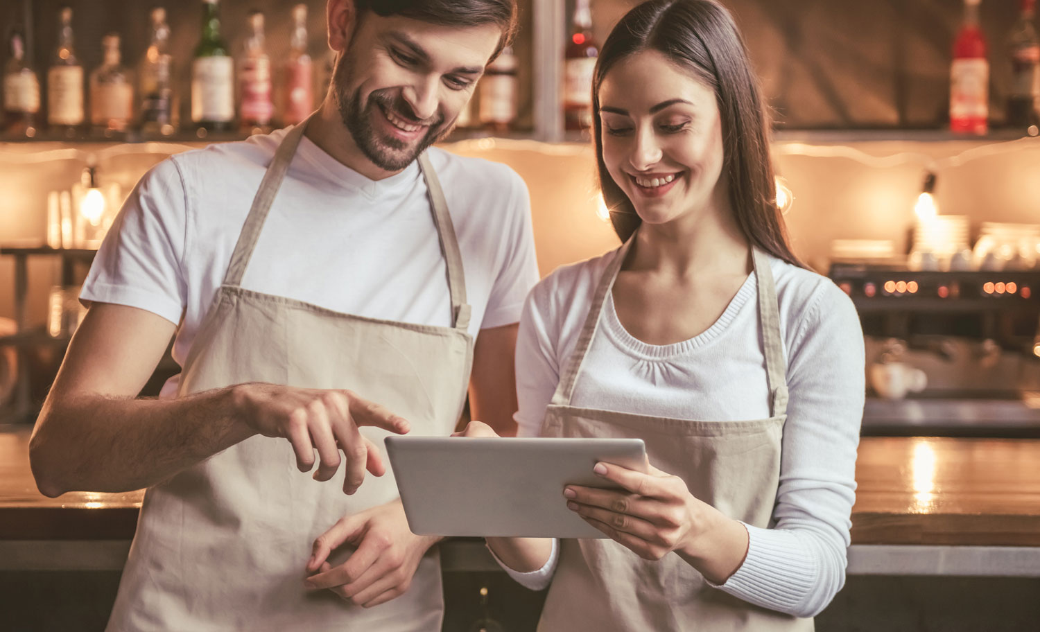 Couple looking at Tablet Barista