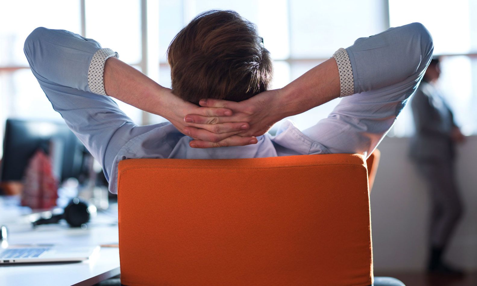 Man relaxing at desk